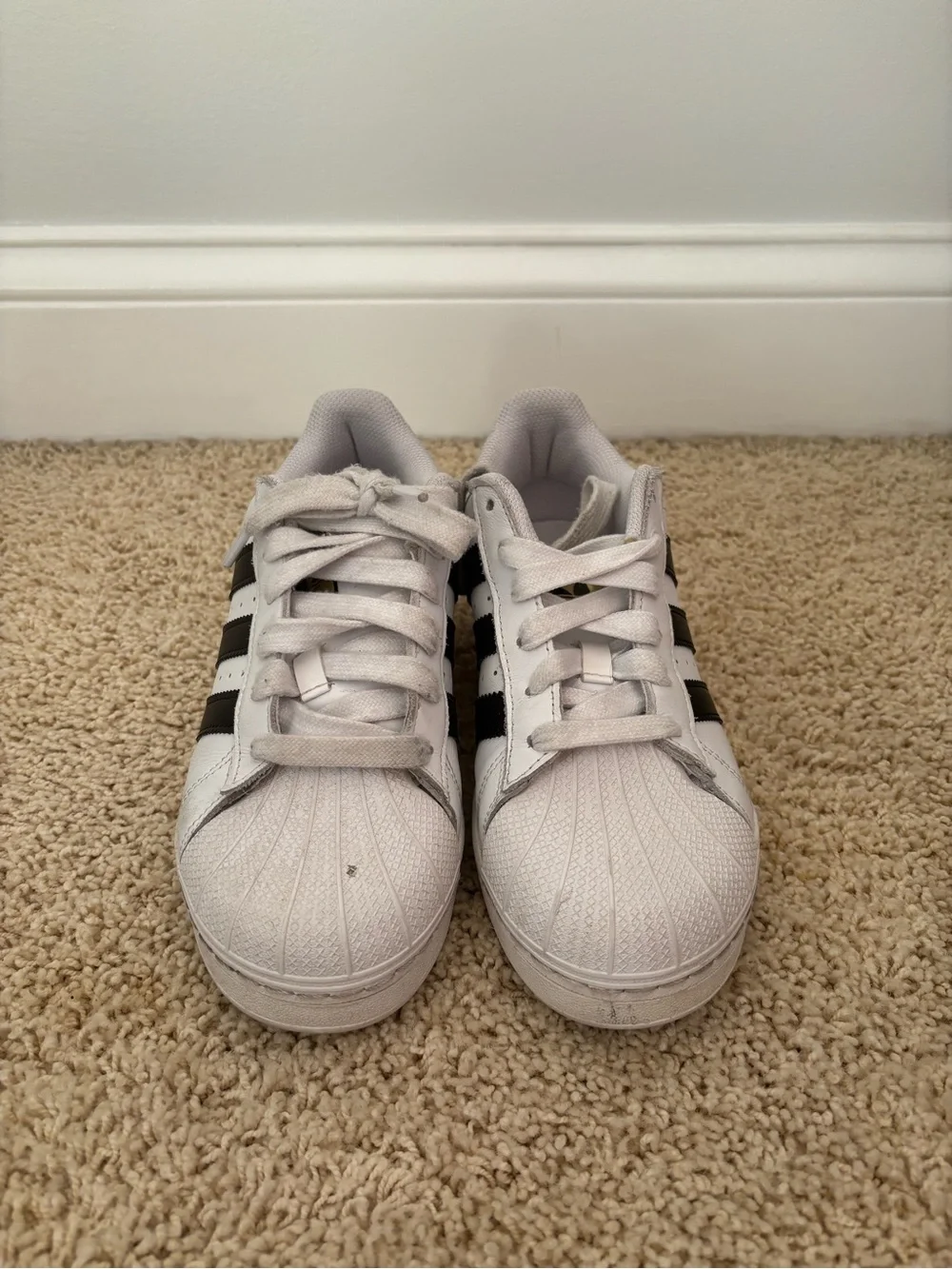 White Adidas Superstars